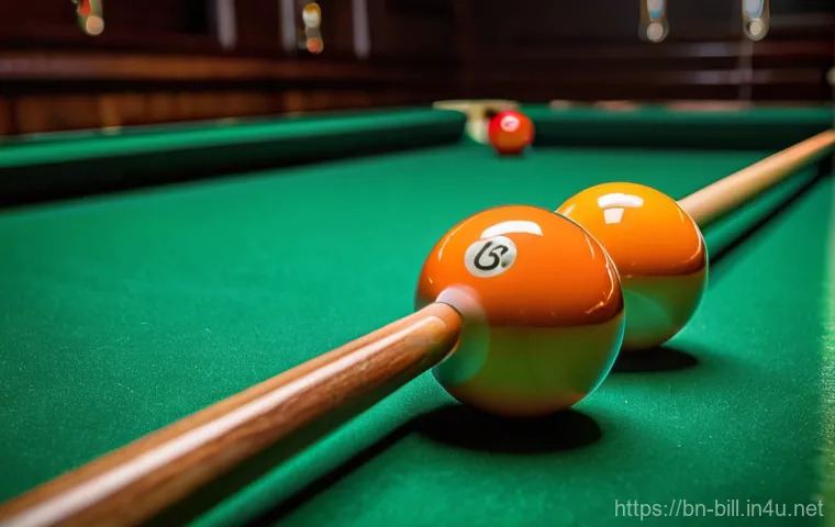 당구 공 정렬 방법 - A close-up, high-angle shot of a billiards table, specifically focusing on a perfectly formed triang...